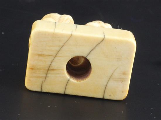 A Japanese ivory netsuke of Binzuru rakan and a tiger, Edo period, height 4.8cm